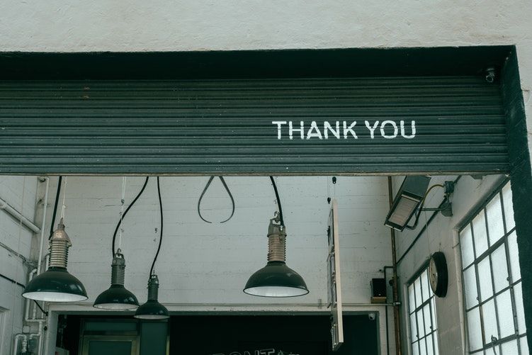 A roll-up door that says 'Thank you'